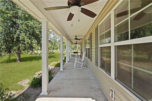 76 Red Gate Rd, Waynesville, GA 31566 - covered porch with ceiling fan and a yard