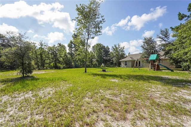 76 Red Gate Rd, Waynesville, GA 31566 - view of grassy yard featuring a playground