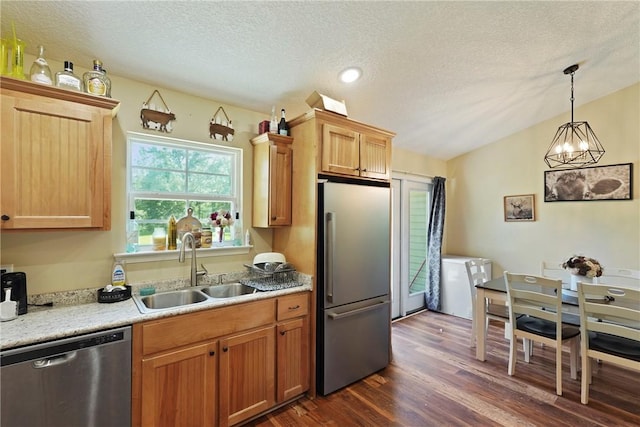 76 Red Gate Rd, Waynesville, GA 31566 - kitchen with appliances with stainless steel finishes, dark wood finished floors, a textured ceiling, light countertops, and decorative light fixtures