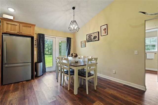 76 Red Gate Rd, Waynesville, GA 31566 - dining room with dark wood-style flooring and vaulted ceiling