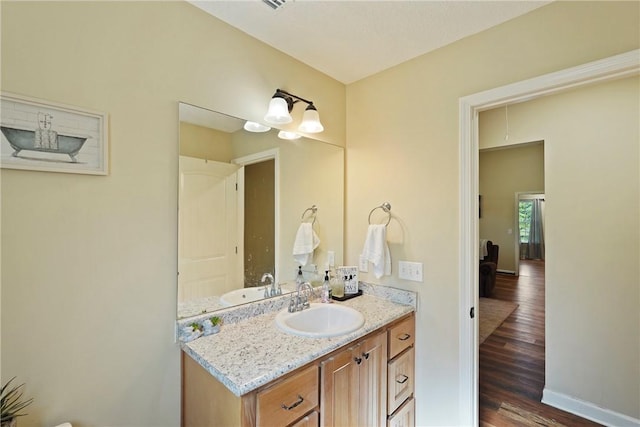 76 Red Gate Rd, Waynesville, GA 31566 - bathroom with wood finished floors and vanity