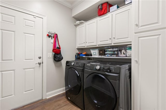 149 Harbor Pointe Dr, Brunswick, GA 31523 - washroom featuring cabinet space, washing machine and dryer, crown molding, baseboards, and wood finished floors
