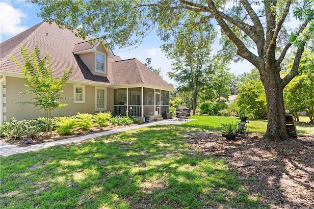 149 Harbor Pointe Dr, Brunswick, GA 31523 - view of grassy yard with a sunroom