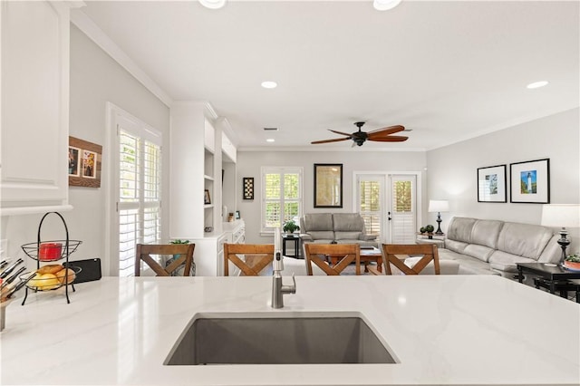 149 Harbor Pointe Dr, Brunswick, GA 31523 - kitchen featuring open floor plan, a sink, a ceiling fan, ornamental molding, and recessed lighting