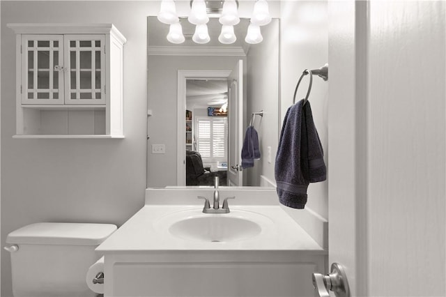 149 Harbor Pointe Dr, Brunswick, GA 31523 - half bathroom with vanity, toilet, a chandelier, and crown molding
