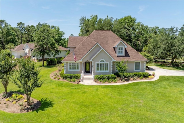 149 Harbor Pointe Dr, Brunswick, GA 31523 - view of front of property with a front lawn and stucco siding