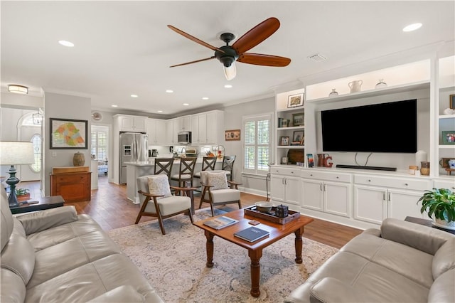 149 Harbor Pointe Dr, Brunswick, GA 31523 - living room featuring ornamental molding, ceiling fan, light wood finished floors, and recessed lighting