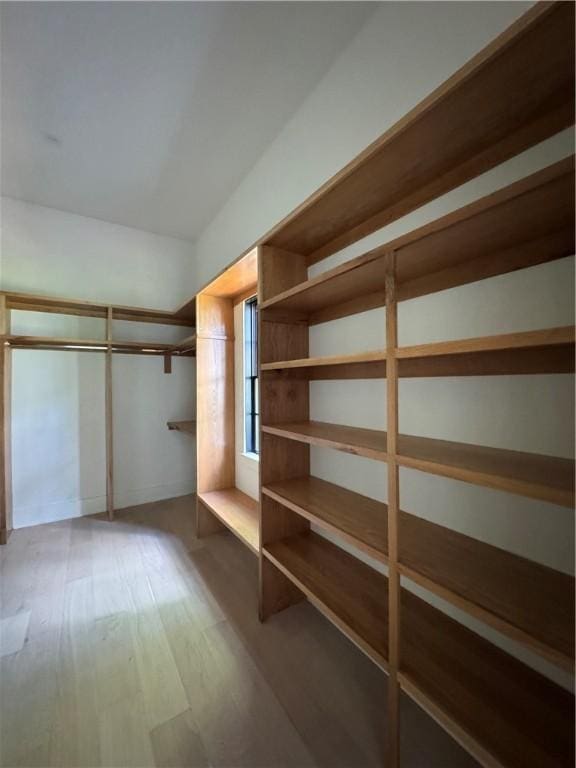 104 Point Ln, Saint Simons Island, GA 31522 - walk in closet with wood finished floors