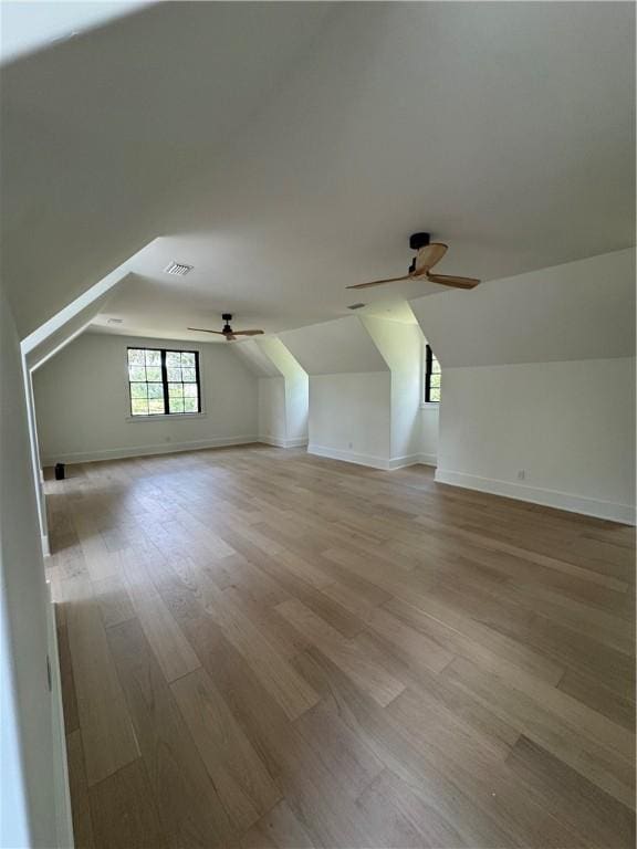 104 Point Ln, Saint Simons Island, GA 31522 - bonus room featuring ceiling fan, vaulted ceiling, wood finished floors, and baseboards