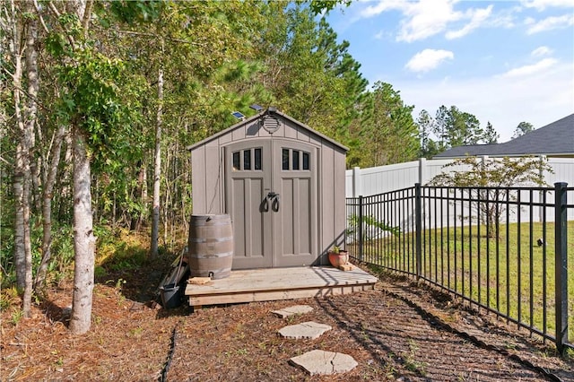 view of outbuilding with a yard