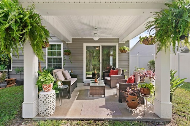 view of patio with an outdoor living space and ceiling fan