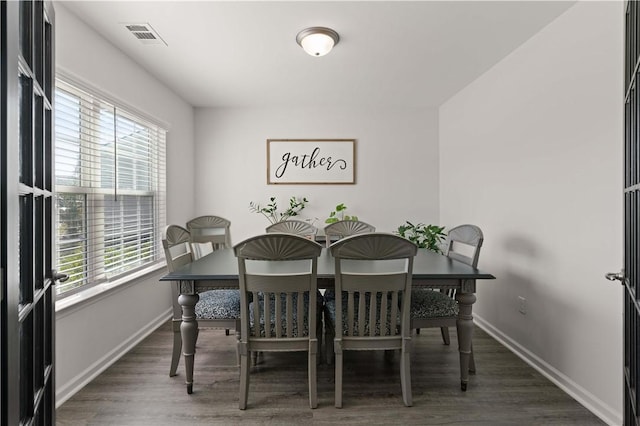 dining room featuring dark hardwood / wood-style flooring