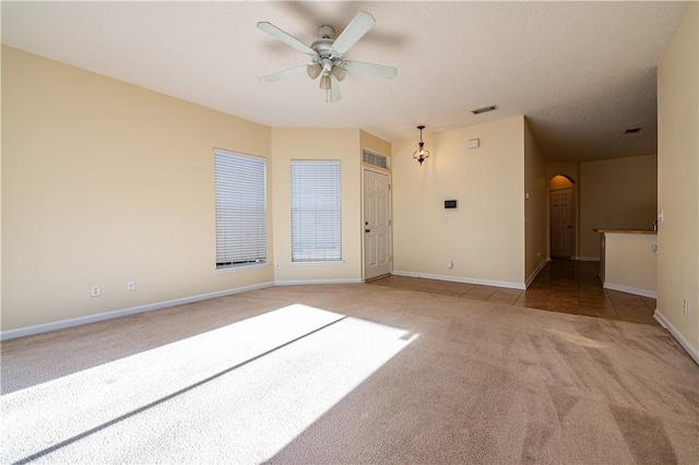 carpeted empty room with ceiling fan