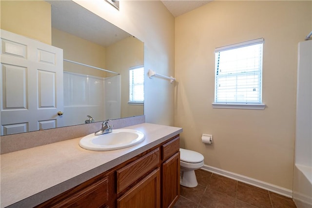 bathroom featuring tile patterned floors, toilet, and vanity