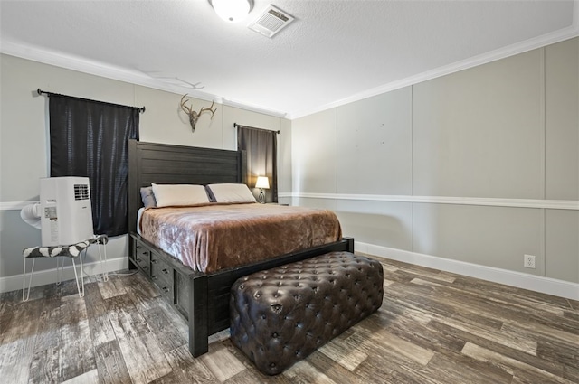 bedroom featuring wood-type flooring and ornamental molding