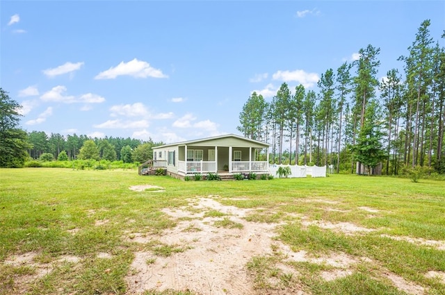 view of yard featuring covered porch