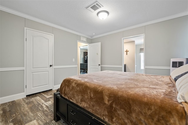 bedroom featuring a textured ceiling, crown molding, and dark wood-type flooring