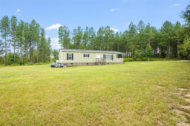 back of house with a lawn