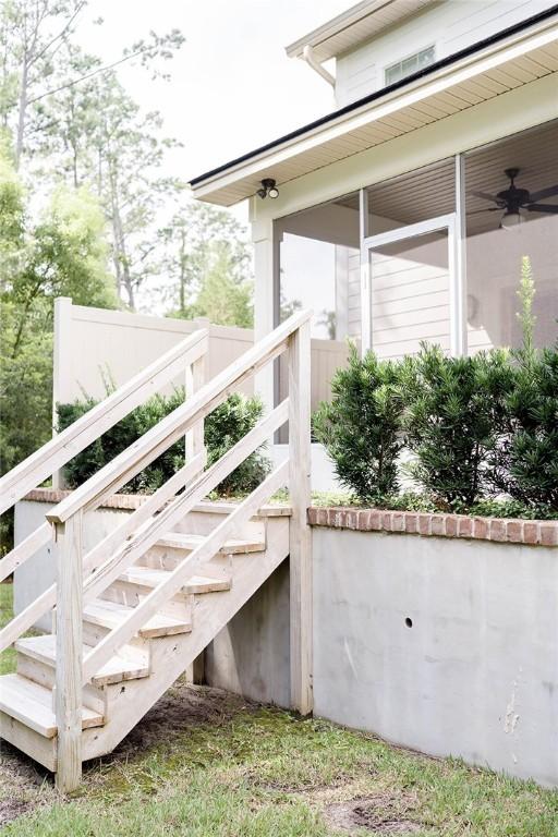 801 Mariners Cir, Saint Simons Island, GA 31522 - exterior space featuring ceiling fan, stairway, and a sunroom