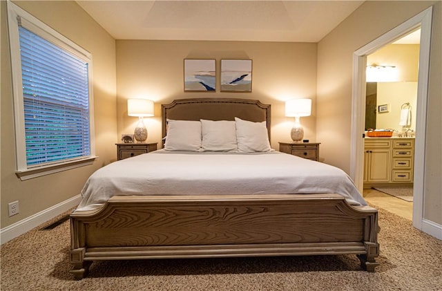 801 Mariners Cir, Saint Simons Island, GA 31522 - bedroom featuring light carpet and ensuite bath