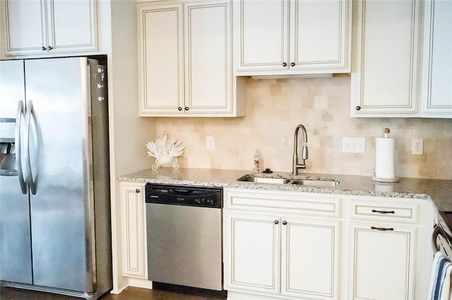 801 Mariners Cir, Saint Simons Island, GA 31522 - kitchen with appliances with stainless steel finishes, light stone countertops, and white cabinetry