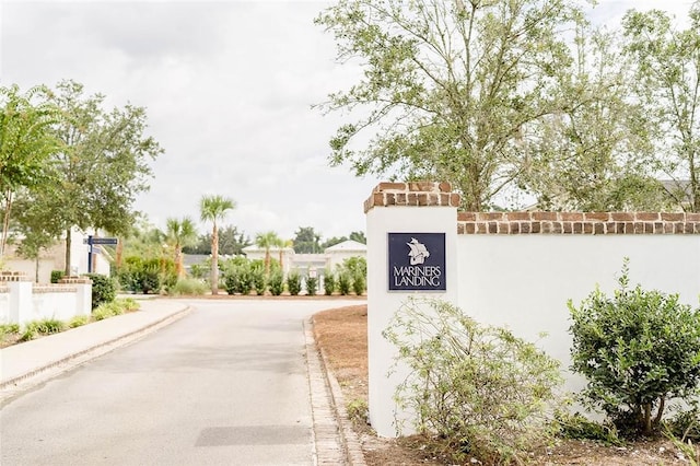 801 Mariners Cir, Saint Simons Island, GA 31522 - view of asphalt road with curbs and sidewalks