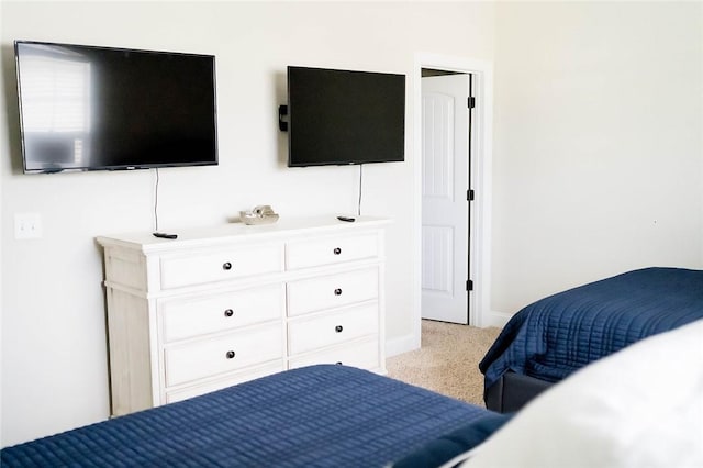 801 Mariners Cir, Saint Simons Island, GA 31522 - bedroom with light colored carpet and baseboards