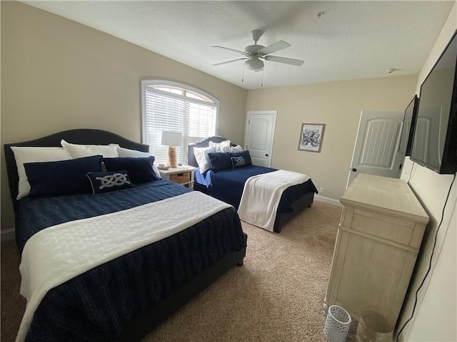 801 Mariners Cir, Saint Simons Island, GA 31522 - bedroom featuring carpet floors, ceiling fan, and a textured ceiling