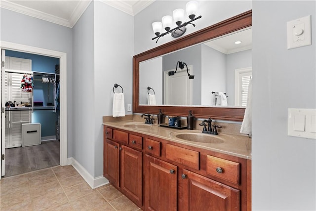 bathroom with tile patterned flooring, vanity, and crown molding