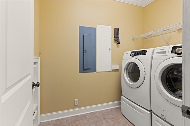 laundry room featuring separate washer and dryer, light tile patterned floors, electric panel, and ornamental molding