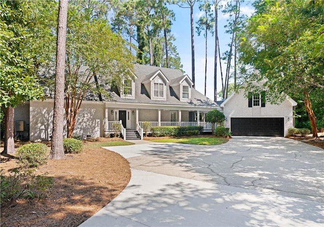 new england style home with a porch and a garage