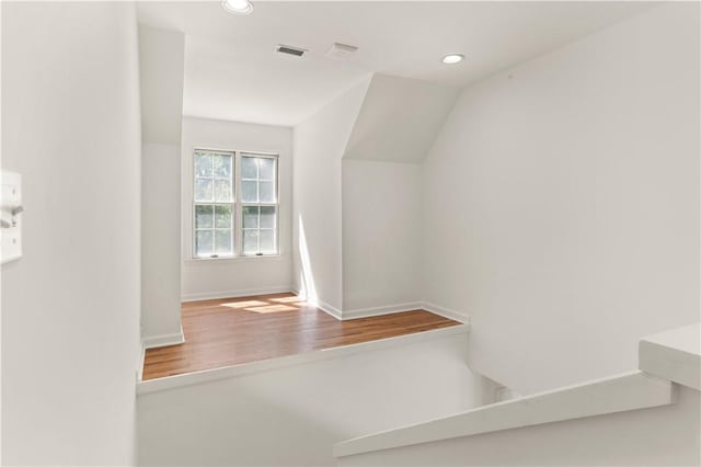 rec room featuring light wood-type flooring, vaulted ceiling, and billiards