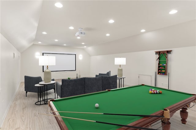 interior space featuring light hardwood / wood-style floors and lofted ceiling