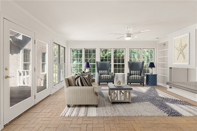 sunroom / solarium with ceiling fan