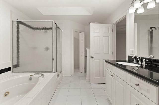 bathroom with tile patterned floors, separate shower and tub, and vanity