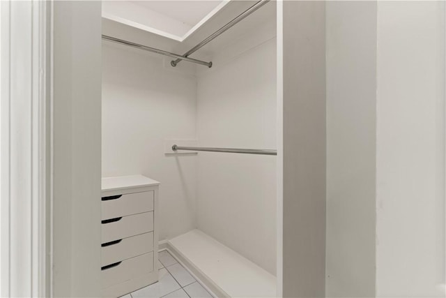 walk in closet featuring light tile patterned floors