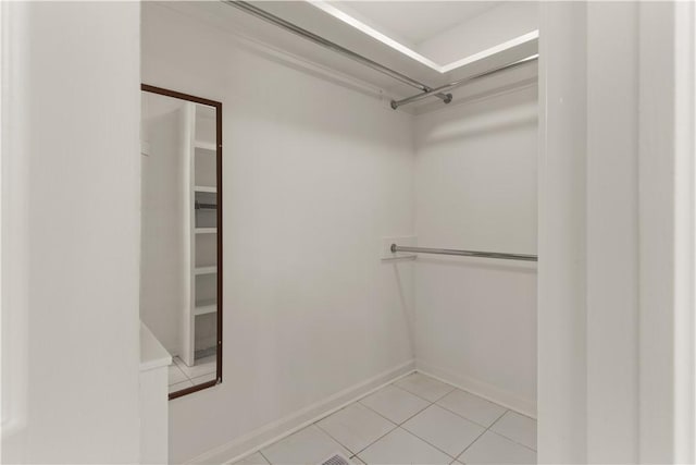 walk in closet featuring light tile patterned floors