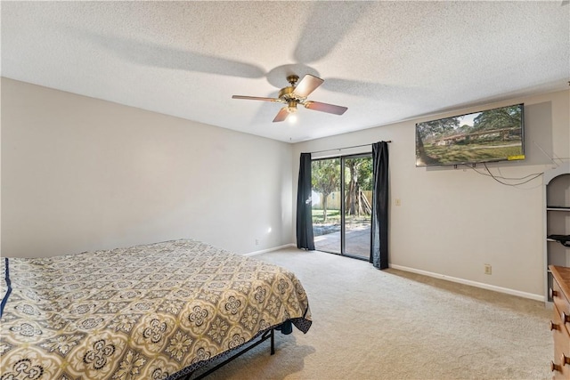 146 Sherwood Forest Cir, Brunswick, GA 31525 - bedroom with access to outside, baseboards, carpet floors, ceiling fan, and a textured ceiling