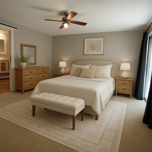 146 Sherwood Forest Cir, Brunswick, GA 31525 - bedroom with light carpet, a ceiling fan, a barn door, and multiple windows