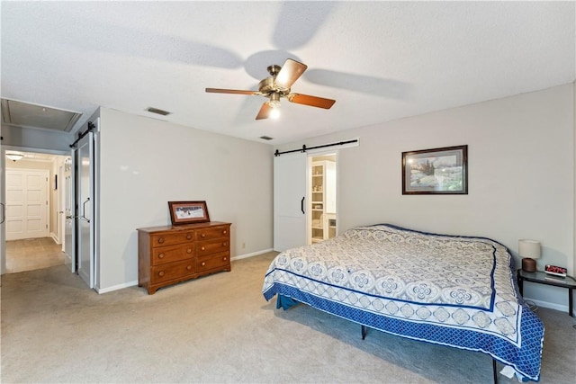 146 Sherwood Forest Cir, Brunswick, GA 31525 - bedroom with a barn door, light colored carpet, a ceiling fan, and baseboards