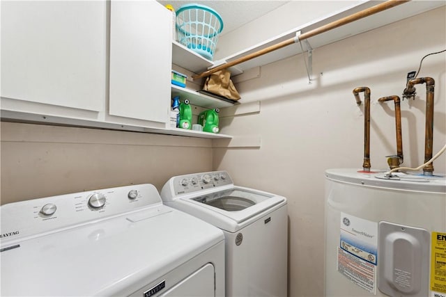 146 Sherwood Forest Cir, Brunswick, GA 31525 - laundry room featuring electric water heater, cabinet space, and independent washer and dryer