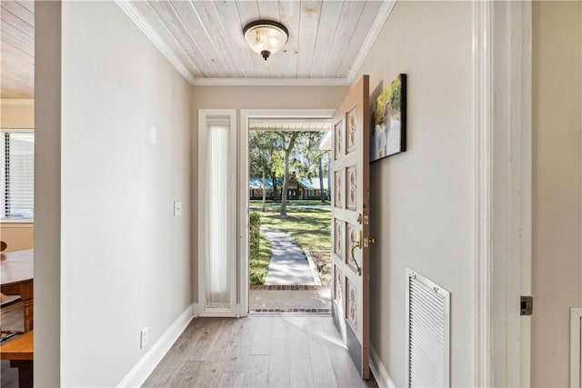 foyer entrance featuring light hardwood / wood-style flooring, crown molding, and wood ceiling