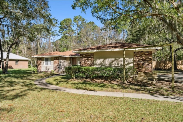 ranch-style home with a front lawn