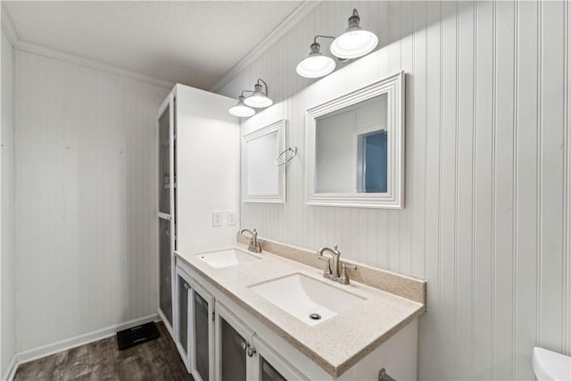 146 Sherwood Forest Cir, Brunswick, GA 31525 - bathroom featuring ornamental molding, double vanity, and wood finished floors