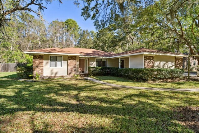 ranch-style house with a front yard