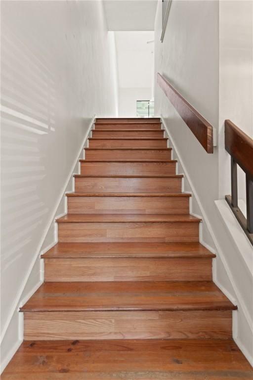 893 Wimbledon Dr, Saint Simons Island, GA 31522 - staircase featuring wood finished floors