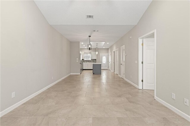 interior space with recessed lighting and baseboards