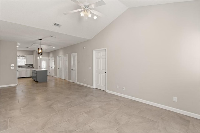 unfurnished living room featuring high vaulted ceiling, baseboards, visible vents, and a ceiling fan