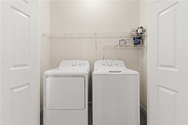 washroom with laundry area and independent washer and dryer