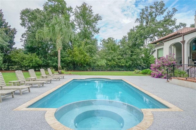 view of pool featuring a lawn and a patio area